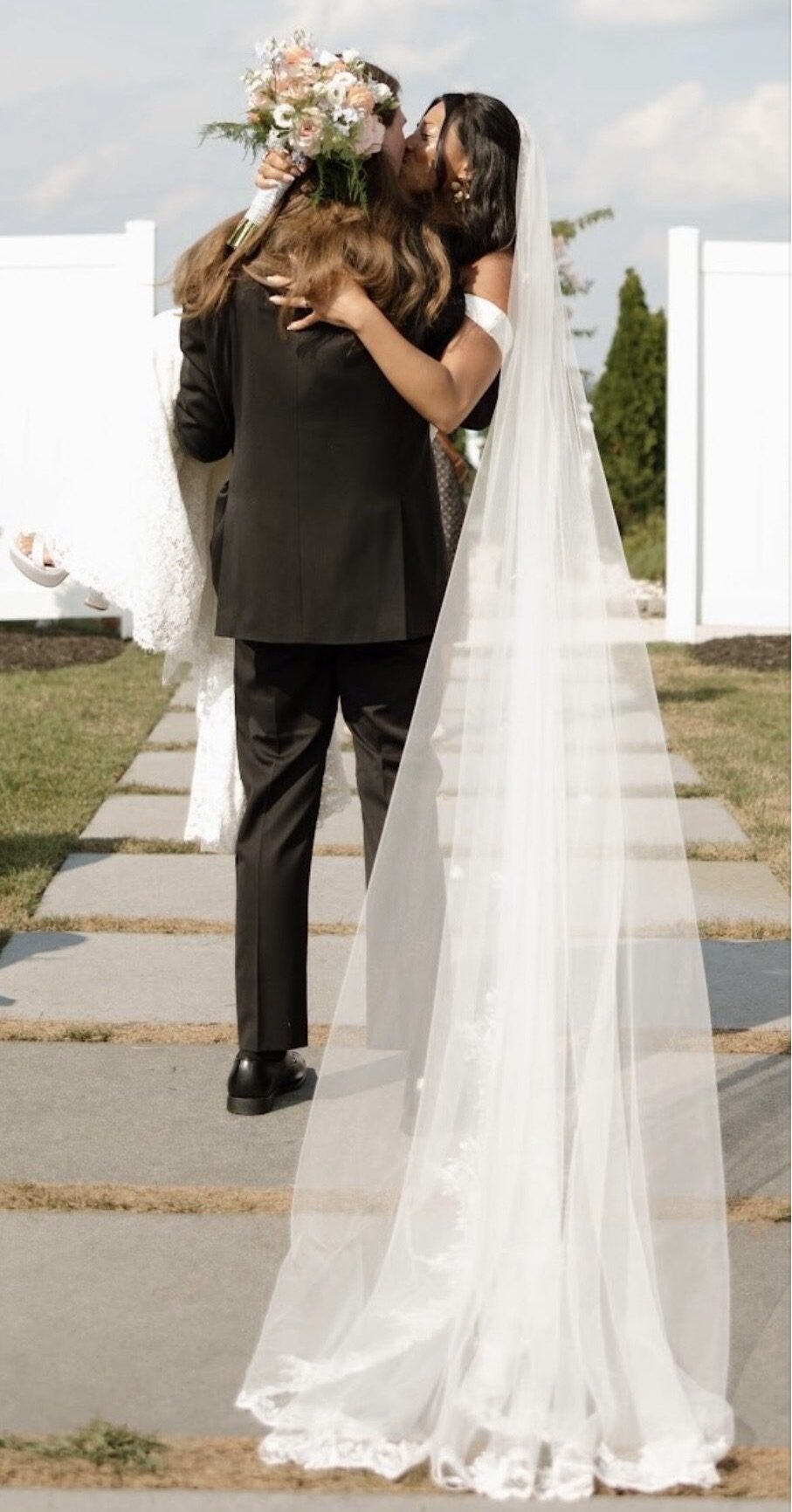 Bride walking down the aisle with her father at a wedding.